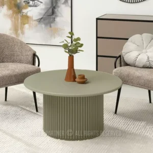 modern round pedestal coffee table with fluted base and olive top in Nairobi home