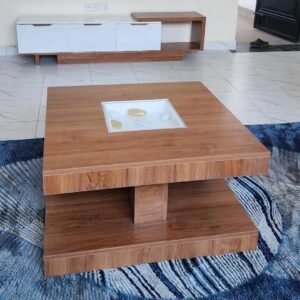 modern wooden TV cabinet with white doors and matching layered coffee table with glass inset in living room Kenya