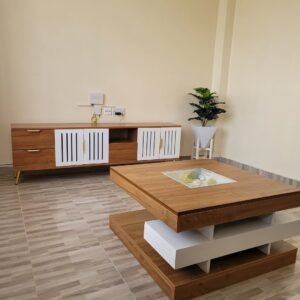 modern wooden TV cabinet with white doors and matching layered coffee table in living room furniture setup Kenya