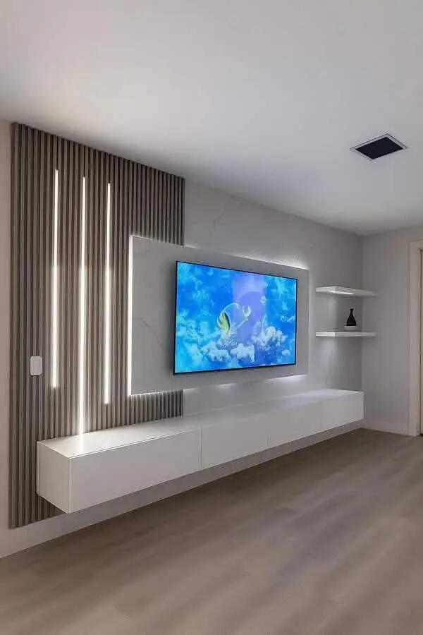 Minimalist TV wall with slat panel, LED light strips and floating console in a modern Kenya living room