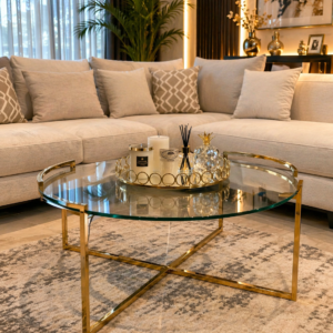 Luxury round glass coffee table with gold frame in a modern living room Kenya
