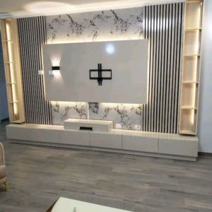 Marble TV wall with slat panels, floating console and LED shelving in a modern Kenya living room