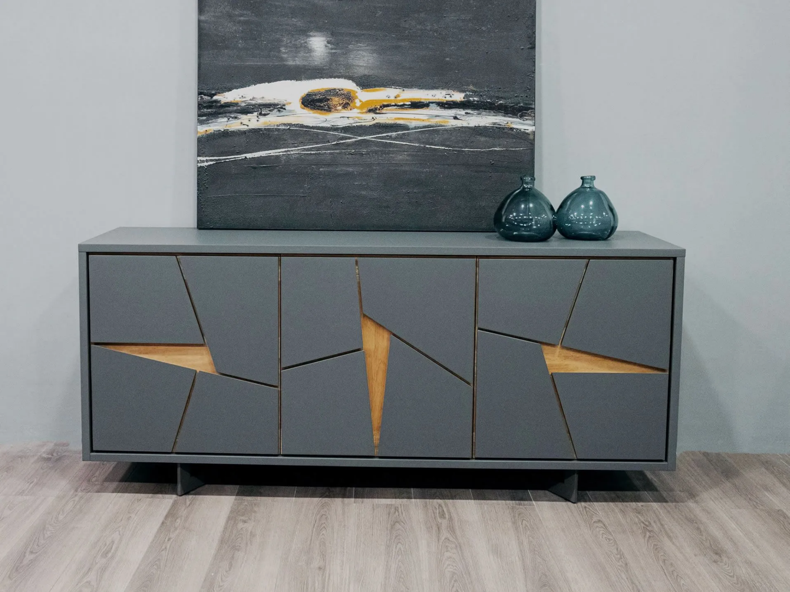 Grey TV cabinet with geometric panels and wood accents in modern living room Kenya