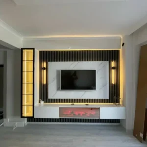 Modern TV wall unit with slatted panels, LED lighting and floating console in Kenya living room