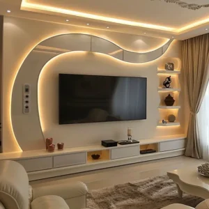 Curved LED TV wall unit with floating console and display shelves in a modern Kenya living room