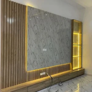 modern TV wall unit with marble panel, wood slats and LED lighting in Nairobi home