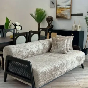 Modern 3 seater sofa with light textured upholstery and black cane-style side panels in Kenya