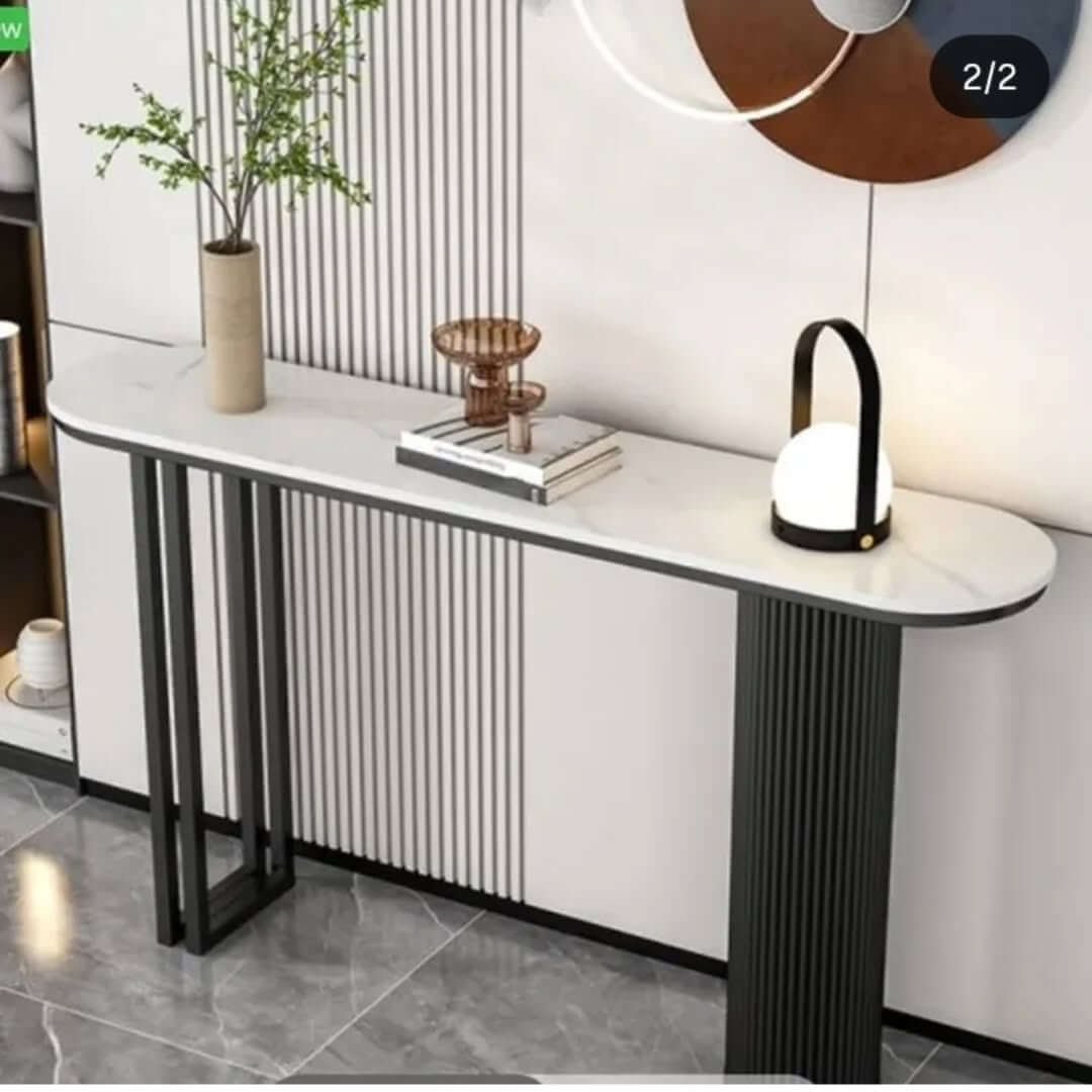 Modern console table with white rounded top, dark trim and fluted base for Kenya entryways