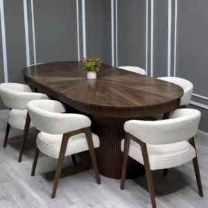Oval dining table set Kenya with dark wood table, fluted base and cream upholstered chairs