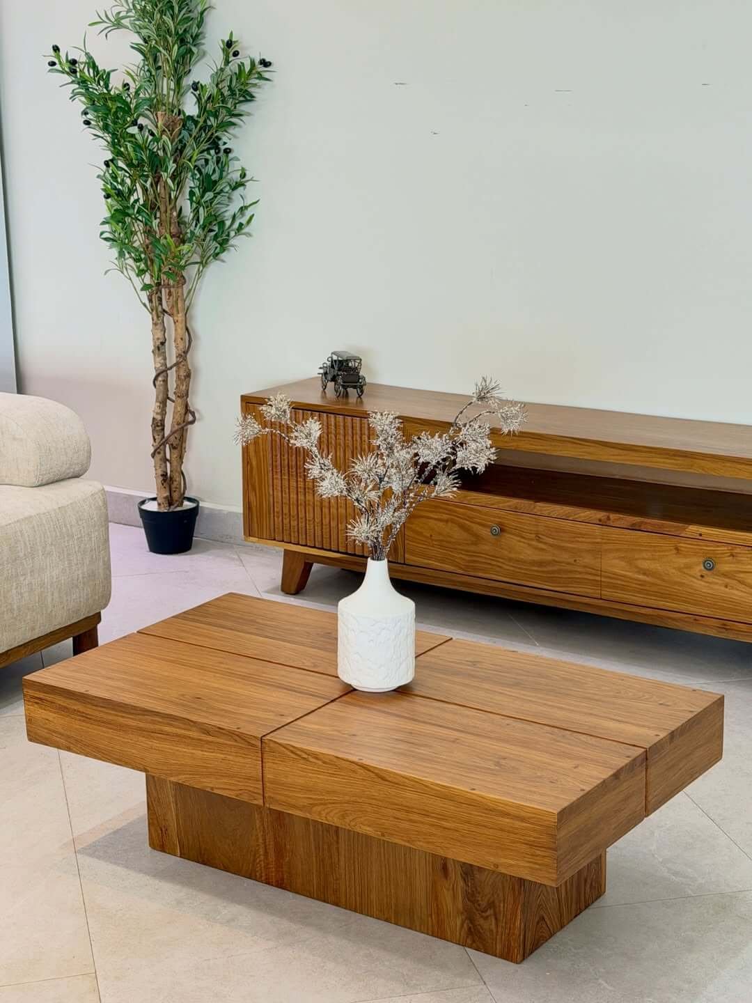 Wooden TV stand Kenya with ribbed cabinet doors, open shelf, drawers, and matching coffee table