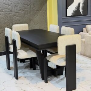 Cream accent chair with rounded arms, textured upholstery and wooden-look legs for Kenya homes