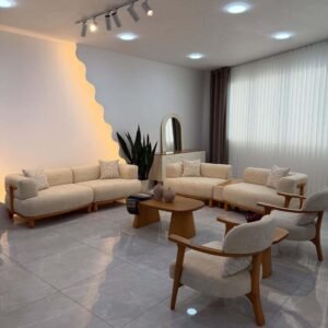 Cream sofa set with oval wooden coffee table styling for Kenya living rooms