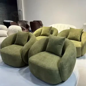 Green textured accent chair with rounded seat and wraparound back for Kenya interiors