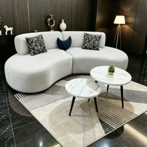 Cream curved sofa with rounded chaise-style seating for Kenya homes and apartments