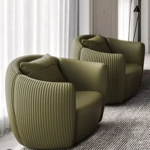 Green textured accent chair with rounded seat and wraparound back for Kenya interiors