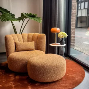 Beige woven accent chair with dark outer shell and curved back for Nairobi lounges
