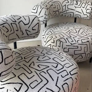 Cream patterned accent chair with black abstract lines and rounded seat for Kenya lounges