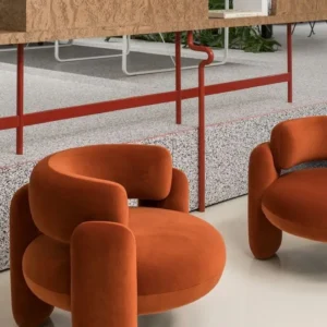 Orange accent chair with rounded arms and circular seat for modern Kenya lounges