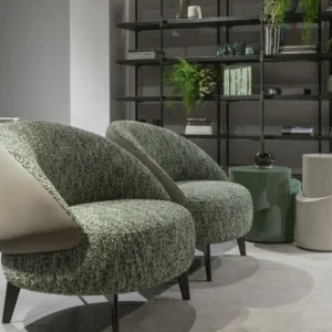Green textured accent chair with rounded seat and wraparound back for Kenya interiors
