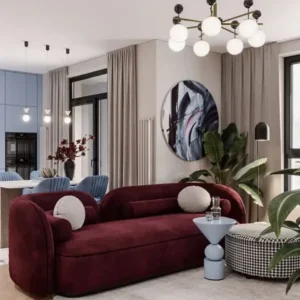 Burgundy curved sofa with rounded arms and cream cushions for modern Kenya lounge interiors