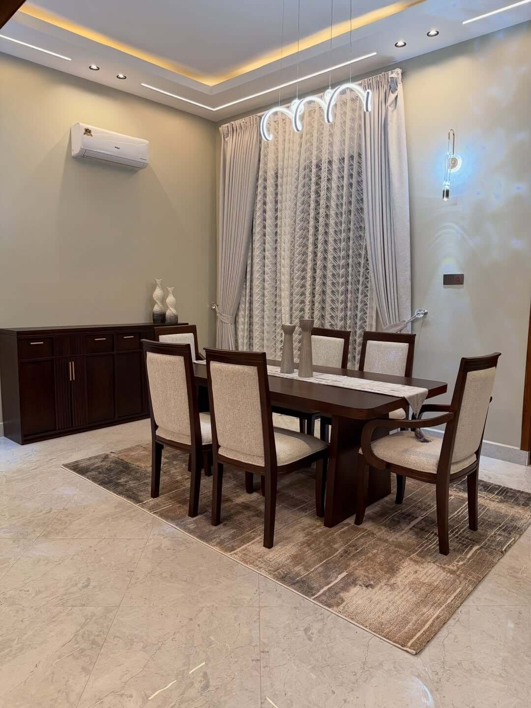 Dark brown 6 seater dining set with cream upholstered chairs for Kenya dining rooms