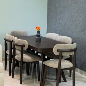 Wooden dining table set Kenya with dark rounded table and light upholstered curved chairs