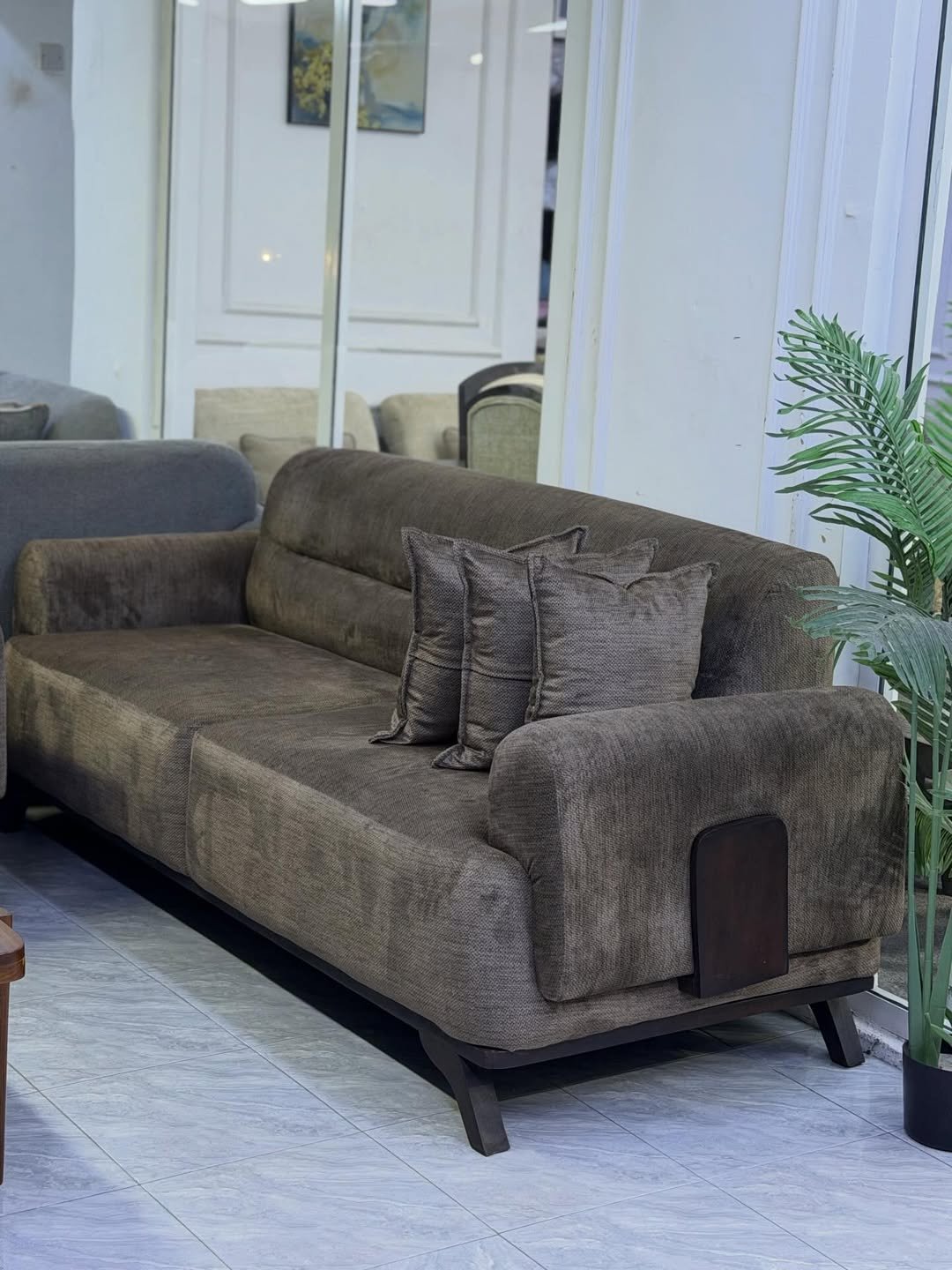 Modern 3 seater sofa Kenya with dark brown fabric-look upholstery and wood side accents