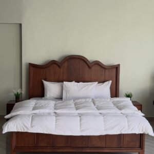 Wooden bed frame Kenya with arched headboard and warm wood finish for Nairobi bedrooms