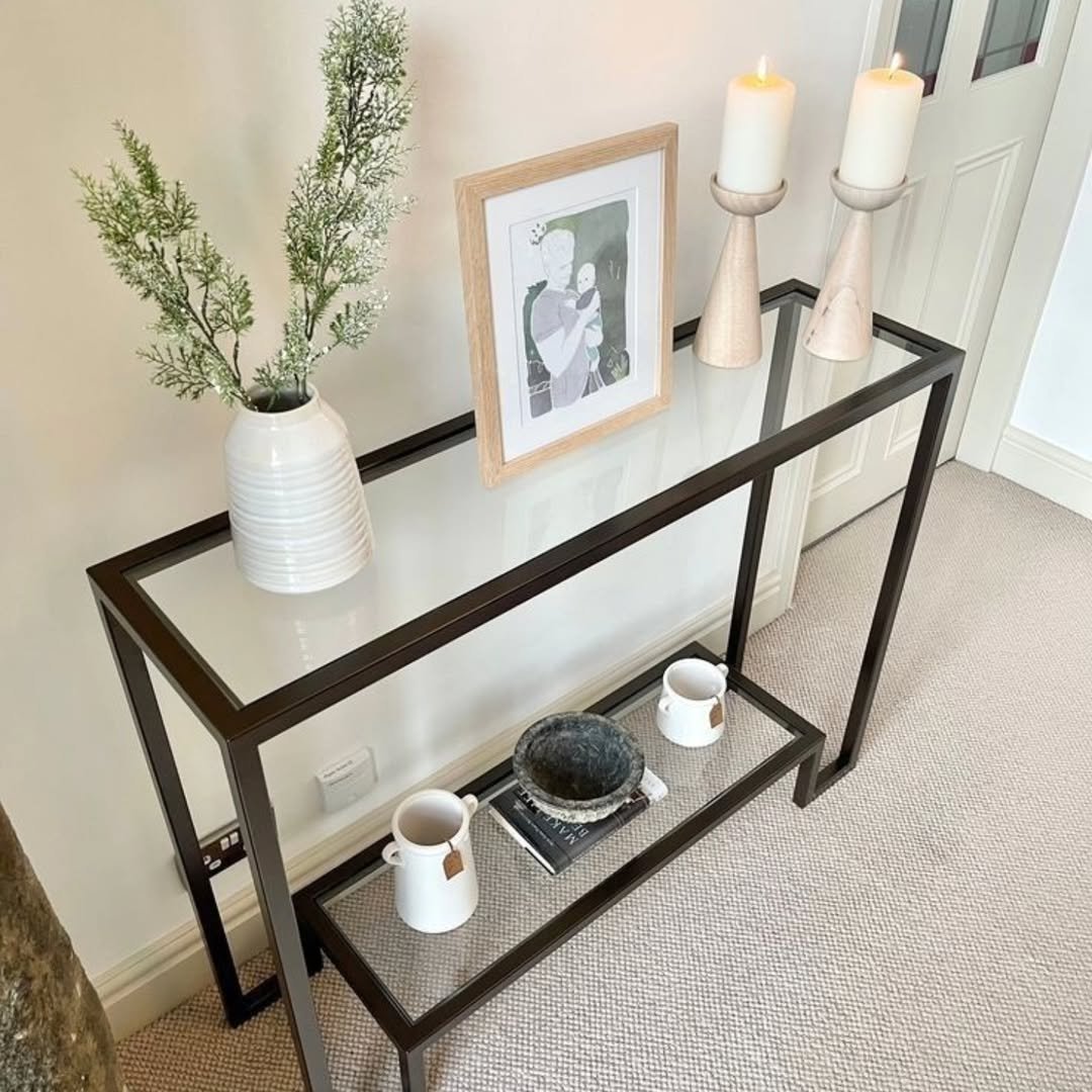 Black glass-style console table with lower shelf for entryways and Nairobi interiors