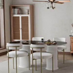 White round dining set with dark marble-look top, fluted pedestal base and gold-leg chairs in Kenya