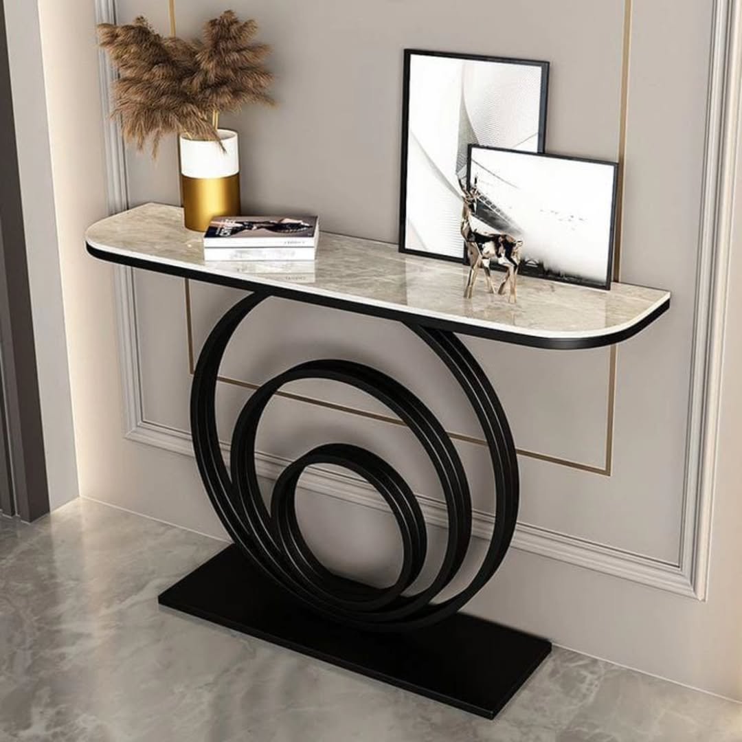 Modern console table with marble-look top and black circular support for entryways in Kenya