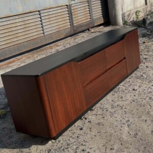 Modern black and wood TV stand with panelled cabinet fronts for Kenya living rooms