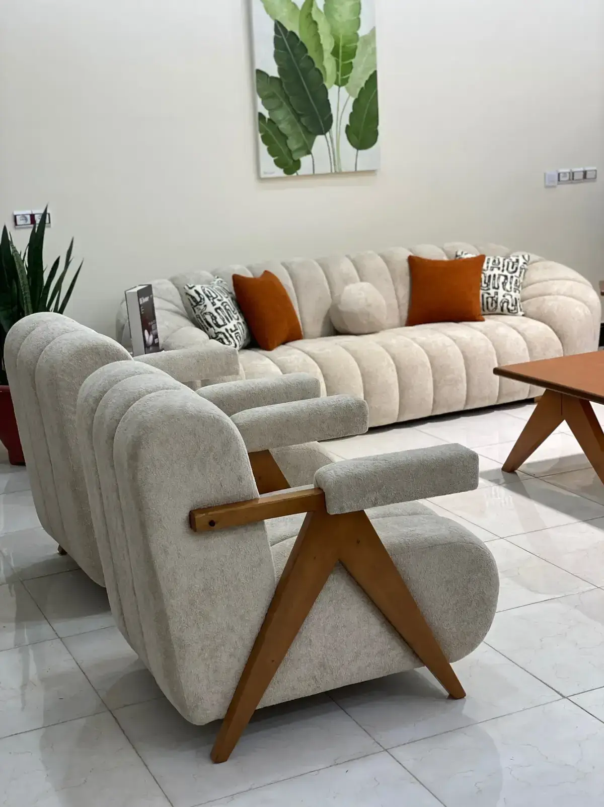 Cream channel-tufted sofa set with cushions for modern living rooms in Kenya