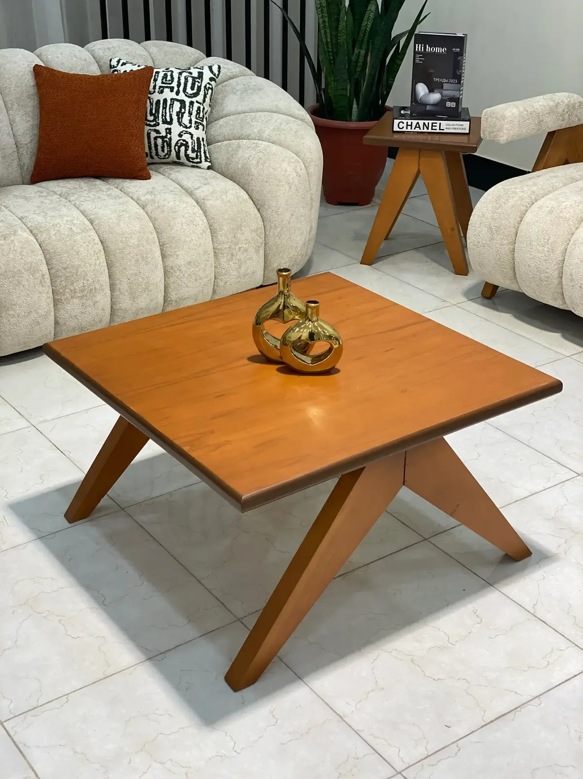 Square wood-look coffee table with angled legs for modern living rooms in Keny