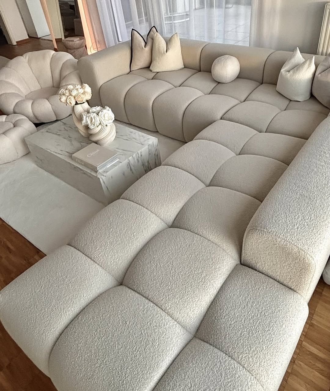 Cream tufted L shape sectional sofa with wide chaise seating for Nairobi lounges