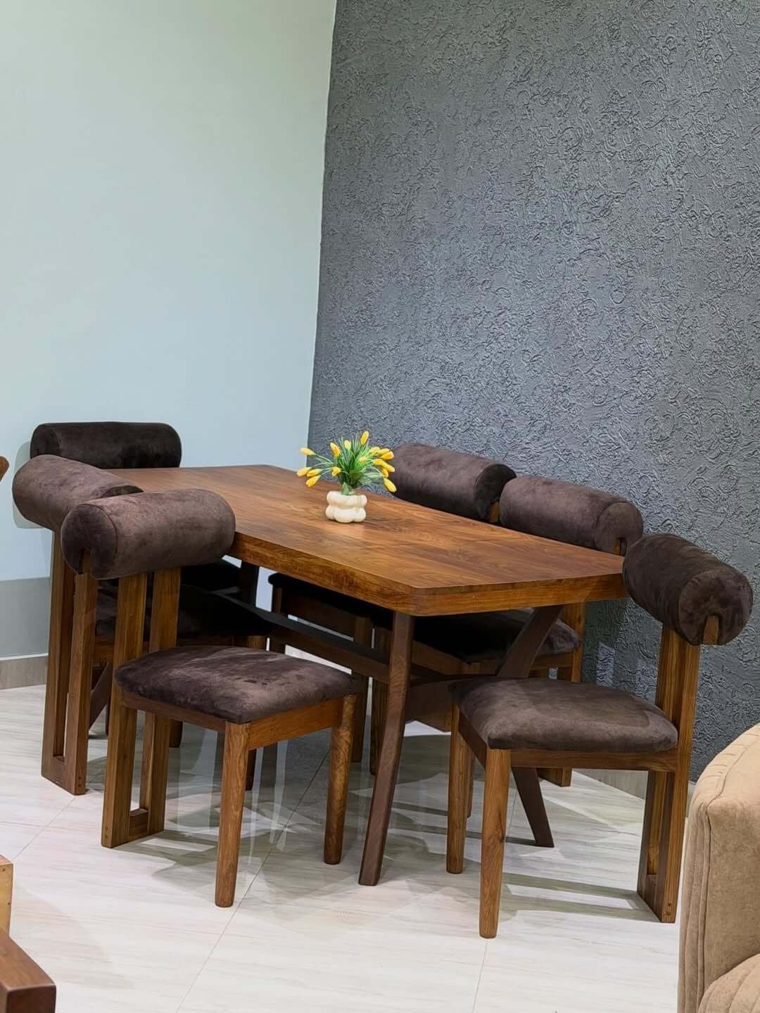 4 seater dining set with warm wood-look table and cream upholstered chairs for Kenya dining rooms