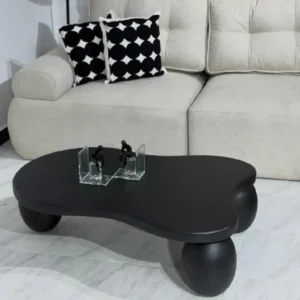 Black coffee table Kenya with organic rounded top and ball-style legs for modern living rooms