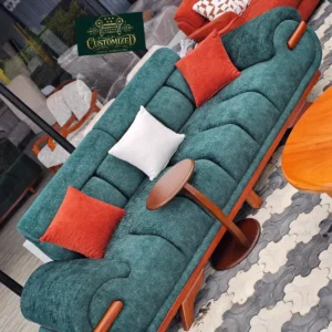 Teal 3 seater sofa Kenya with rolled arms, tufted cushions, and wood-tone accents