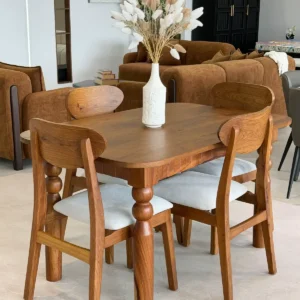 Wooden dining table set Kenya with rounded tabletop, curved chairs and light padded seats
