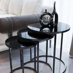 Black nesting coffee table set with glossy round tops and slim circular bases for Kenya living rooms