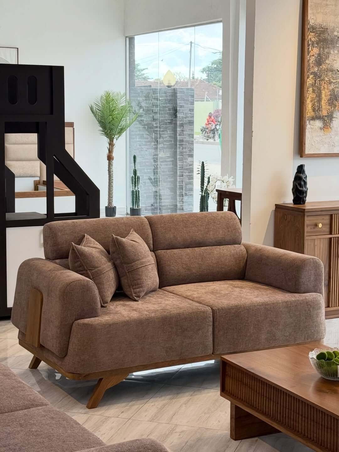 Brown 2 seater sofa with rounded arms, textured upholstery and wood-tone legs for Kenya living rooms