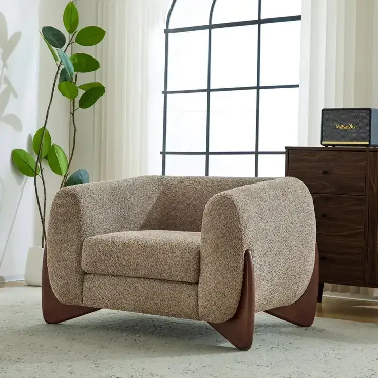 Cream woven accent chair with dark outer shell and curved back for Nairobi lounges