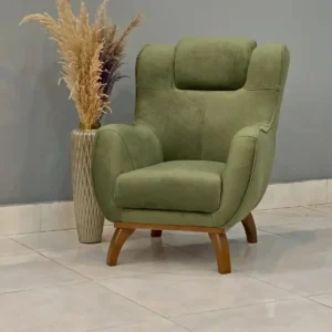 Green accent chair Kenya with high back, rounded arms, stitched panels, and wood-tone legs