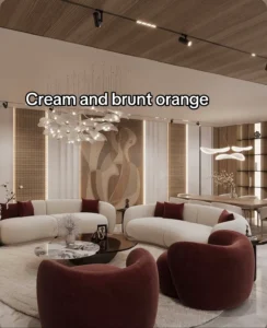 Cream and burnt orange luxury living room — curved white sofas, dark red barrel chairs, sculptural ceiling