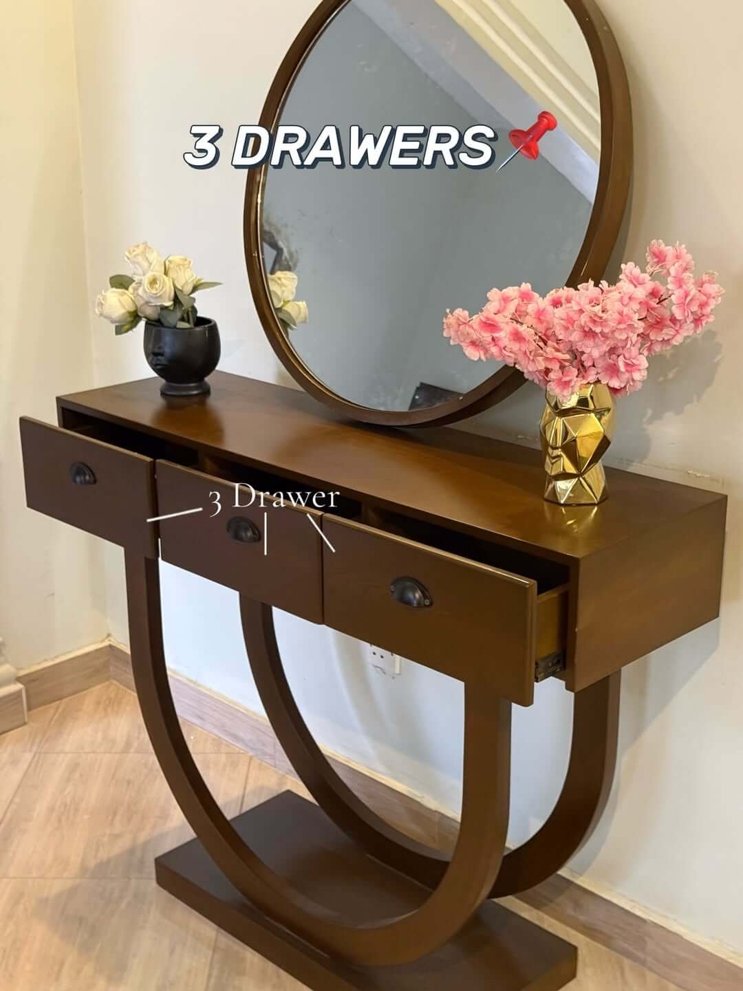 Brown console table with round mirror, curved base and three drawers for Kenya homes