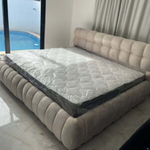 Cream channel tufted upholstered bed frame with padded headboard for Kenya bedrooms