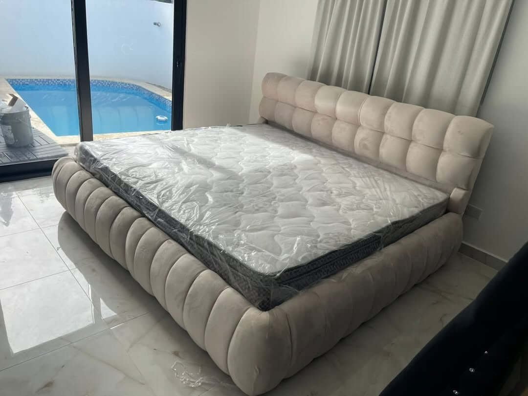 Cream channel tufted upholstered bed frame with padded headboard for Kenya bedrooms