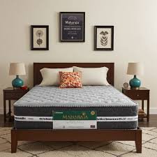5×6×10 Maharaja open coil ortho mattress Kenya on wooden bed frame with white and grey finish