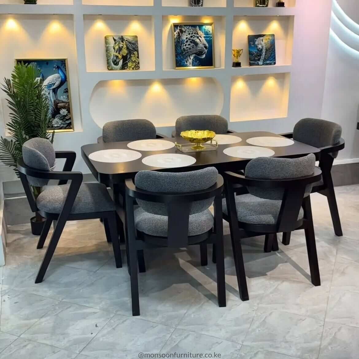 Charcoal curved 6 seater dining set Kenya with upholstered dining chairs and rounded dining table.