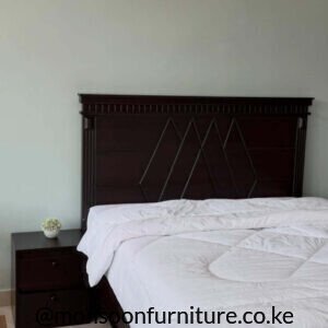 Dark Mvule wood 6×6 panel bed with decorative geometric headboard in Kenya